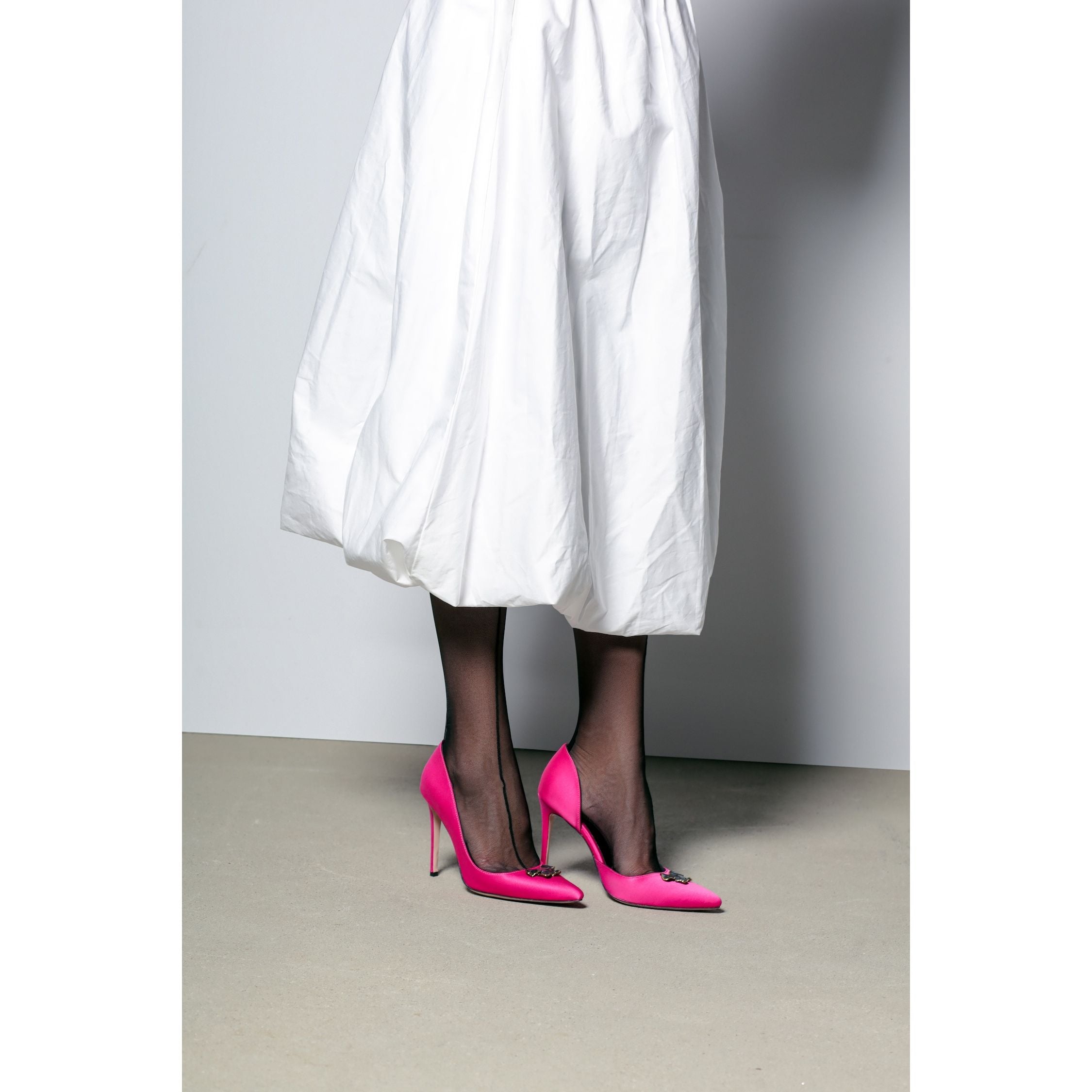fuchsia satin stilettos 10cm with flower accessory with model white skirt